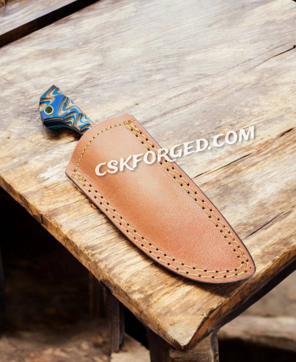 CSKforged Prideful Fang Caping Damascus 6.6-inch EDC survival knife with a full tang blade and textured handle for outdoor use.
