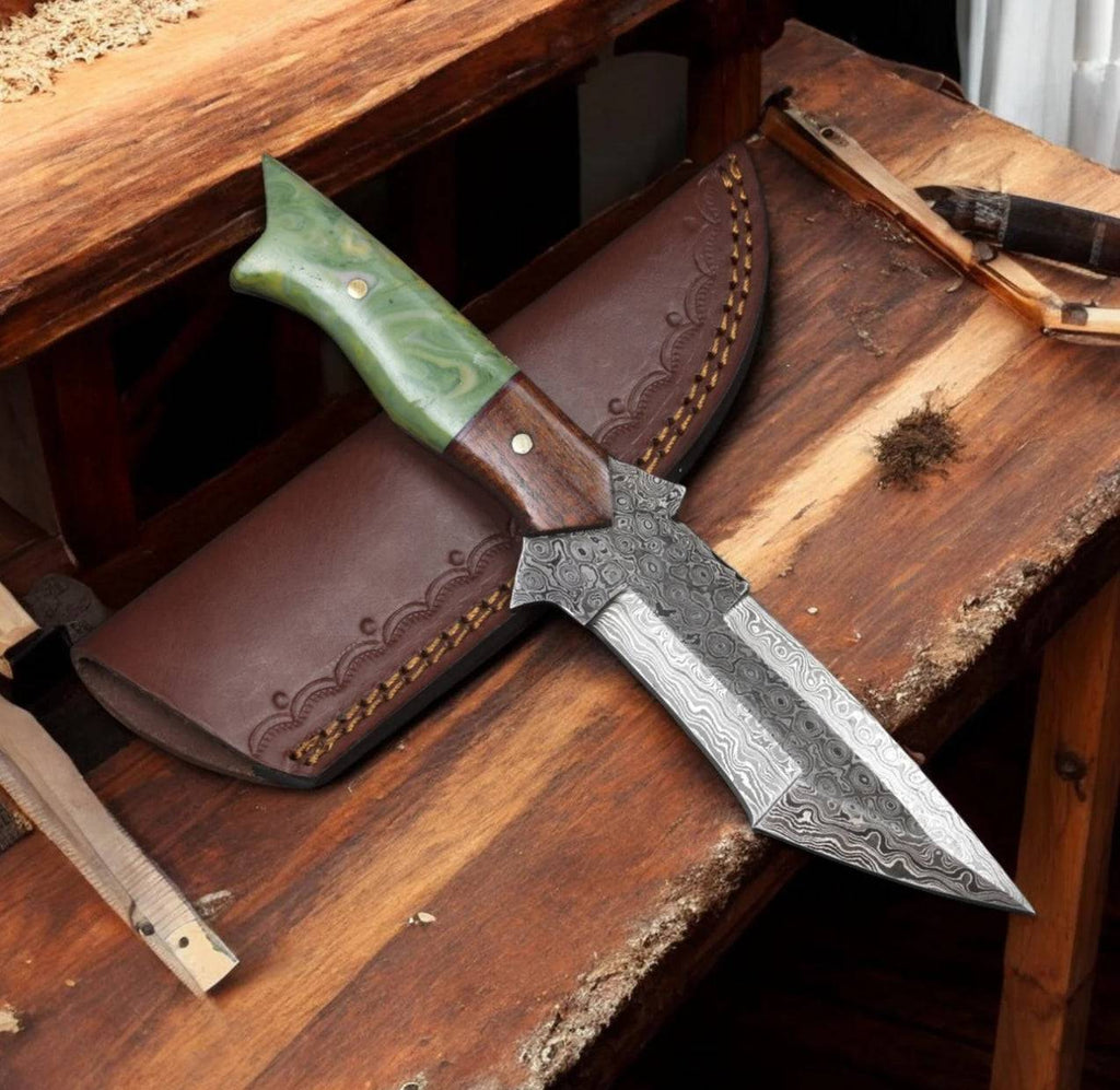 Full view of cskforged camel bone handle Damascus steel hunting knife with a sharp blade and intricate forging details.