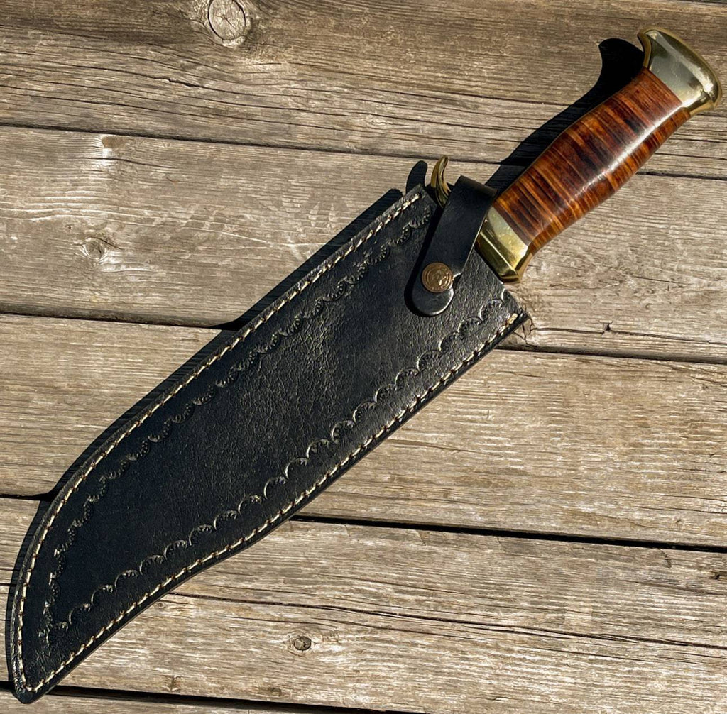 Cskforged Brave Exploration II outdoor hunting Bowie knife with a leather handle and stainless steel blade, displayed on a wooden surface.