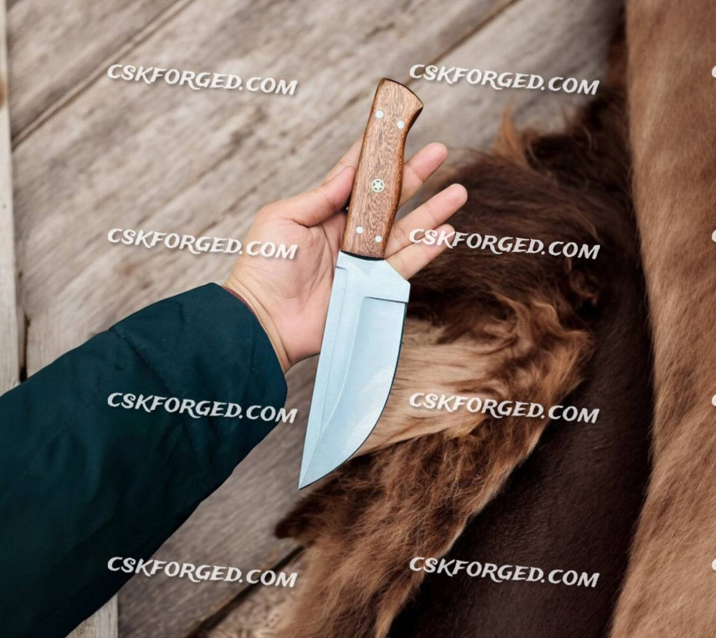 Frostfang handmade hunting knife with walnut wood handle and stainless steel blade, crafted by cskforged.
