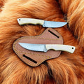 Pair of CSKForged camel bone fixed blade skinning knives with leather sheaths, ideal for EDC outdoor and hunting use