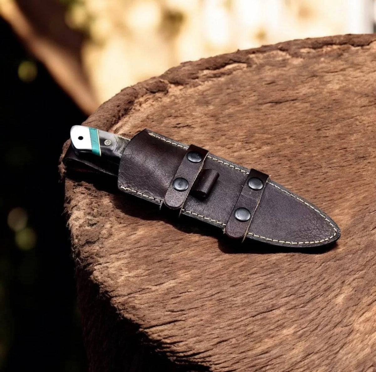 Handmade Damascus sheep hunting knife by cskforged with a textured handle and sharp blade, designed for outdoor hunting use.