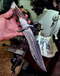 Handmade Bowie knife with a leather handle and stainless steel blade, crafted by Knives Gear Garage.