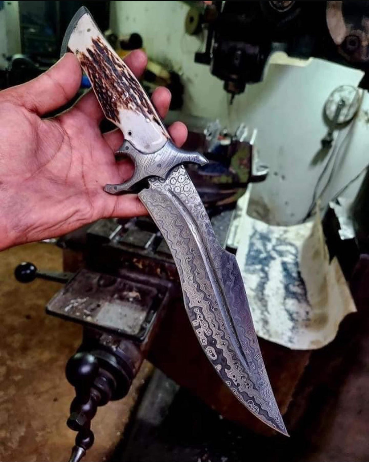 Handmade Bowie knife with a leather handle and stainless steel blade, crafted by Knives Gear Garage.