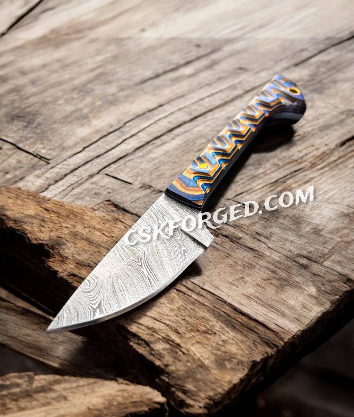 Prideful Fang Caping Damascus 6.6-inch EDC survival knife by cskforged with a full tang blade and textured handle for outdoor use.