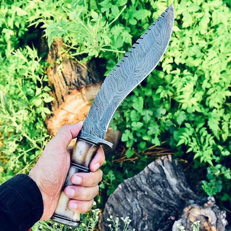 Damascus Steel Kukri Knife from Knives Gear Garage with a curved blade and wooden handle, displayed on a neutral background.