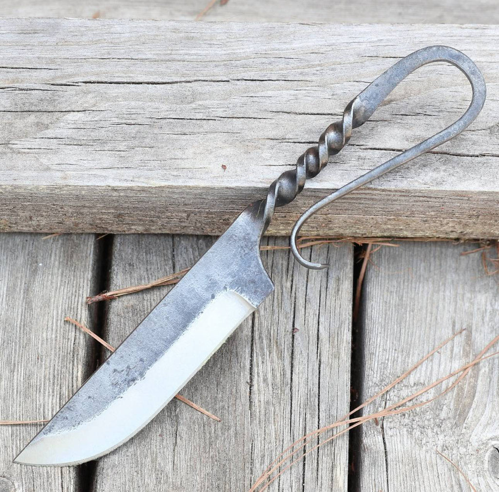 Two medieval-inspired forged iron hunting knives with leather sheaths, crafted by cskforged, perfect for feasting or outdoor use.