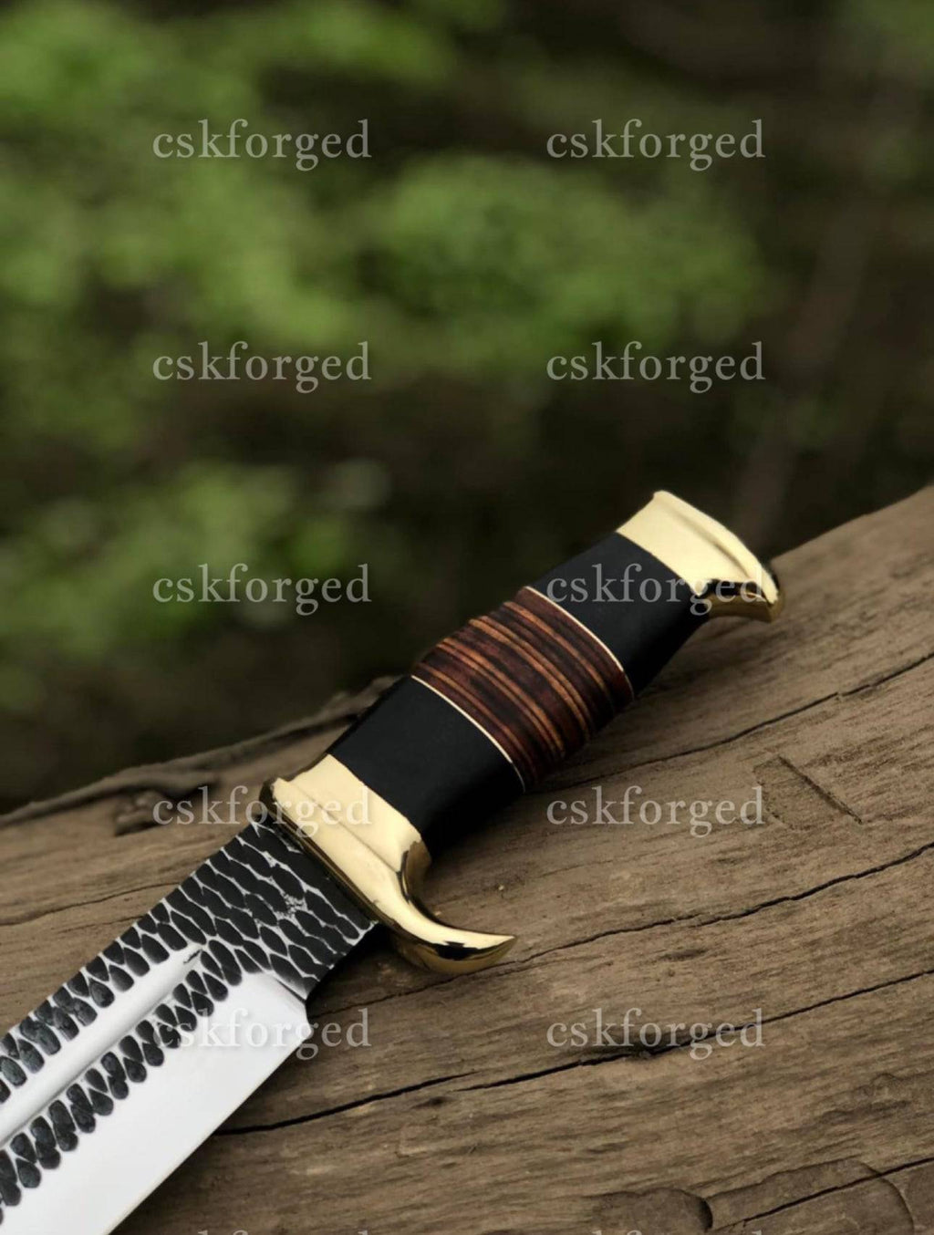 Custom handmade Dundee knife by cskforged featuring a crocodile Dundee-inspired design with a sharp blade and textured handle.