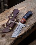 Cskforged Explorer's Companion Tom Brown 10-inch Damascus hunting knife with resin and wood handle, full view of the blade and handle.