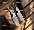 Frontier Ranger Custom Old West hunting knife set by CSKForged with leather sheaths and rustic wooden handles displayed on a wooden surface.