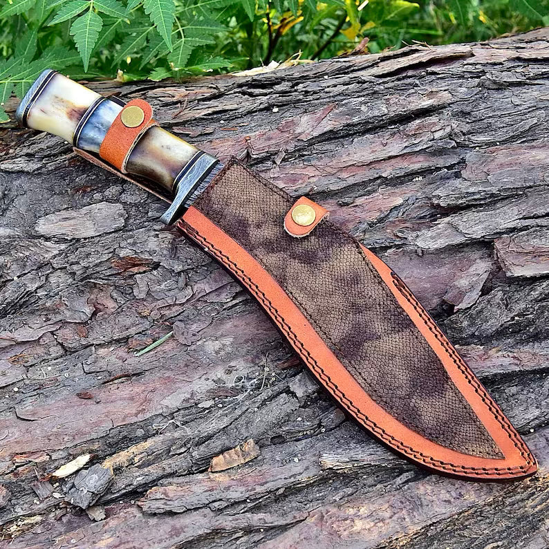 Damascus steel Kukri knife with a curved blade and wooden handle from Knives Gear Garage, displayed on a wooden surface.