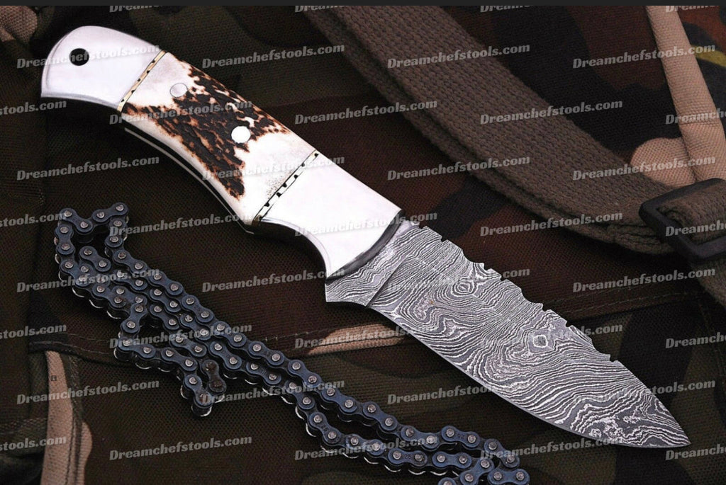 Custom handmade Damascus steel hunting knife handle with polished stag horn, featuring intricate craftsmanship and natural wood grain.