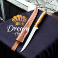 Hand-forged 13" Damascus steel fillet fish knife with orange pine cone resin handle and leather sheath, ideal for precise fish filleting.