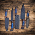 Handcrafted Knives Gear Garage kitchen knife set with forged steel blades and wenge wood handles on a cutting board.