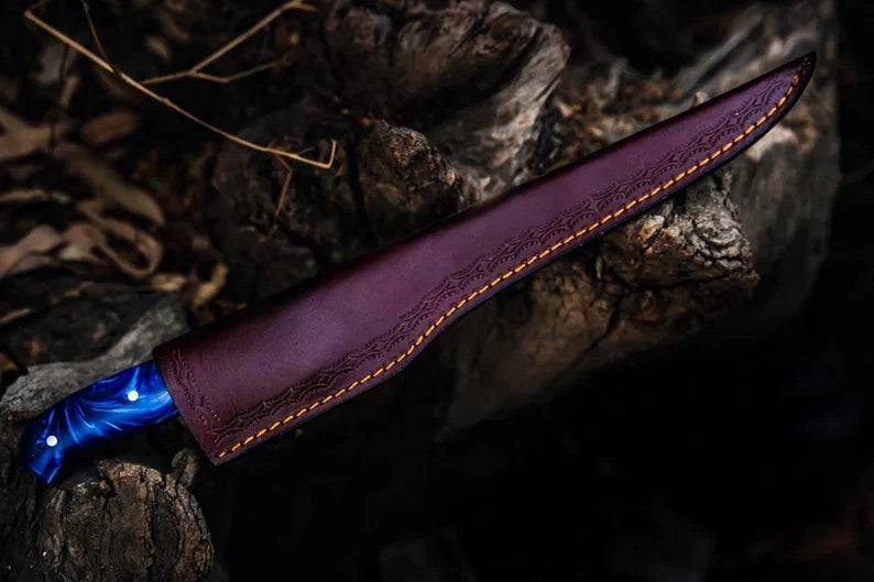 Handmade 13-inch Damascus fillet knife with blue resin handle and steel bolster, crafted for precise fish filleting.