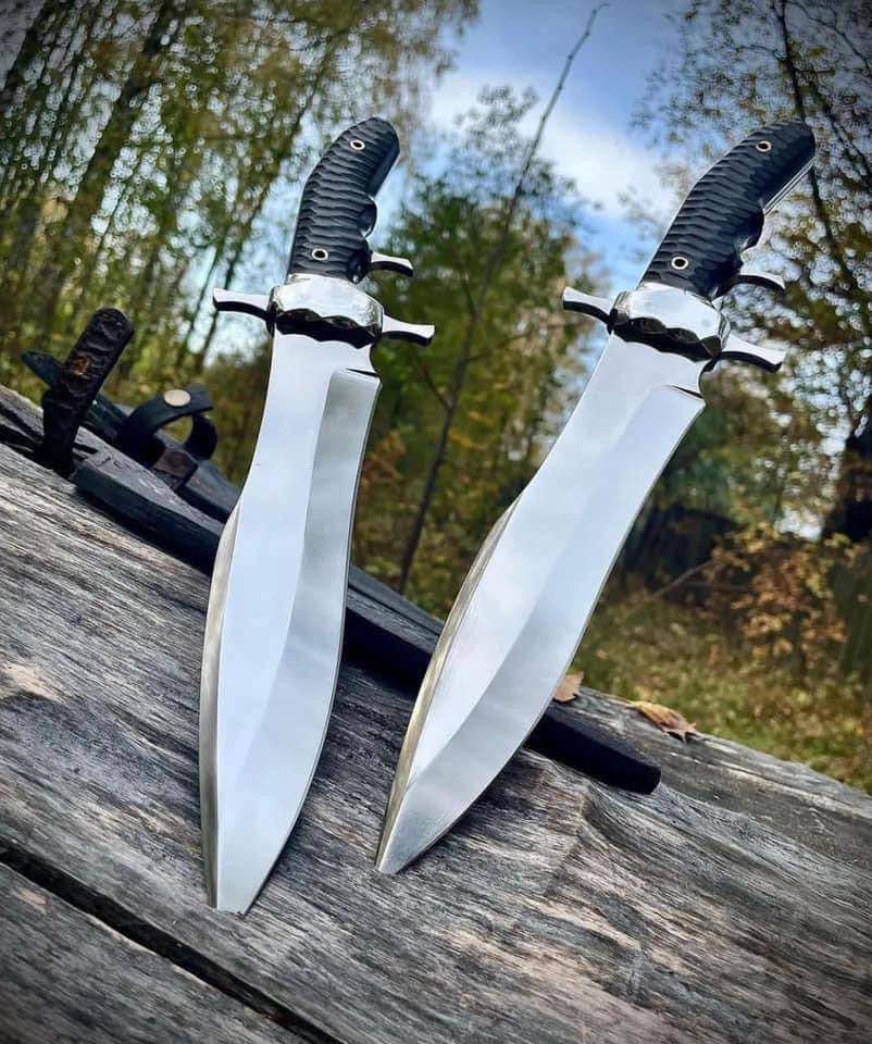 Custom handmade D2 steel Bowie knife with steel guard, buffalo horn handle, and leather sheath by Knives Gear Garage.
