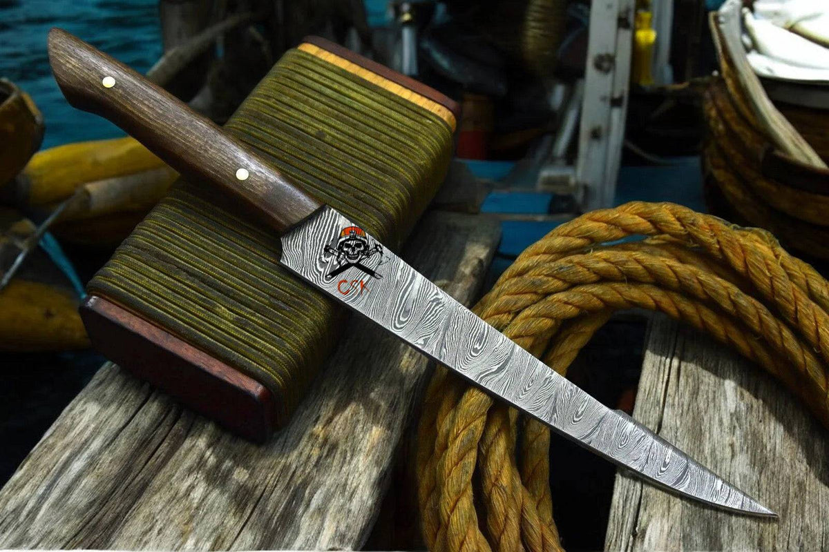 Handmade personalized Damascus fillet knife with rosewood handle by cskforged, showcasing a sleek, sharp fishing fillet knife.