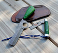 Handmade Damascus cowboy knives set with crossdraw sheath by cskforged, showcasing detailed blades and durable leather sheath.