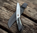 Handmade stone texture vintage hunting knife with 1095 high carbon steel blade by cskforged, featuring a detailed handle and robust design.