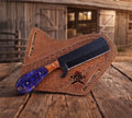 Cowboy knife by cskforged with 1095 steel bullcutter blade, resin handle, and pancake sheath, displayed on a plain background.