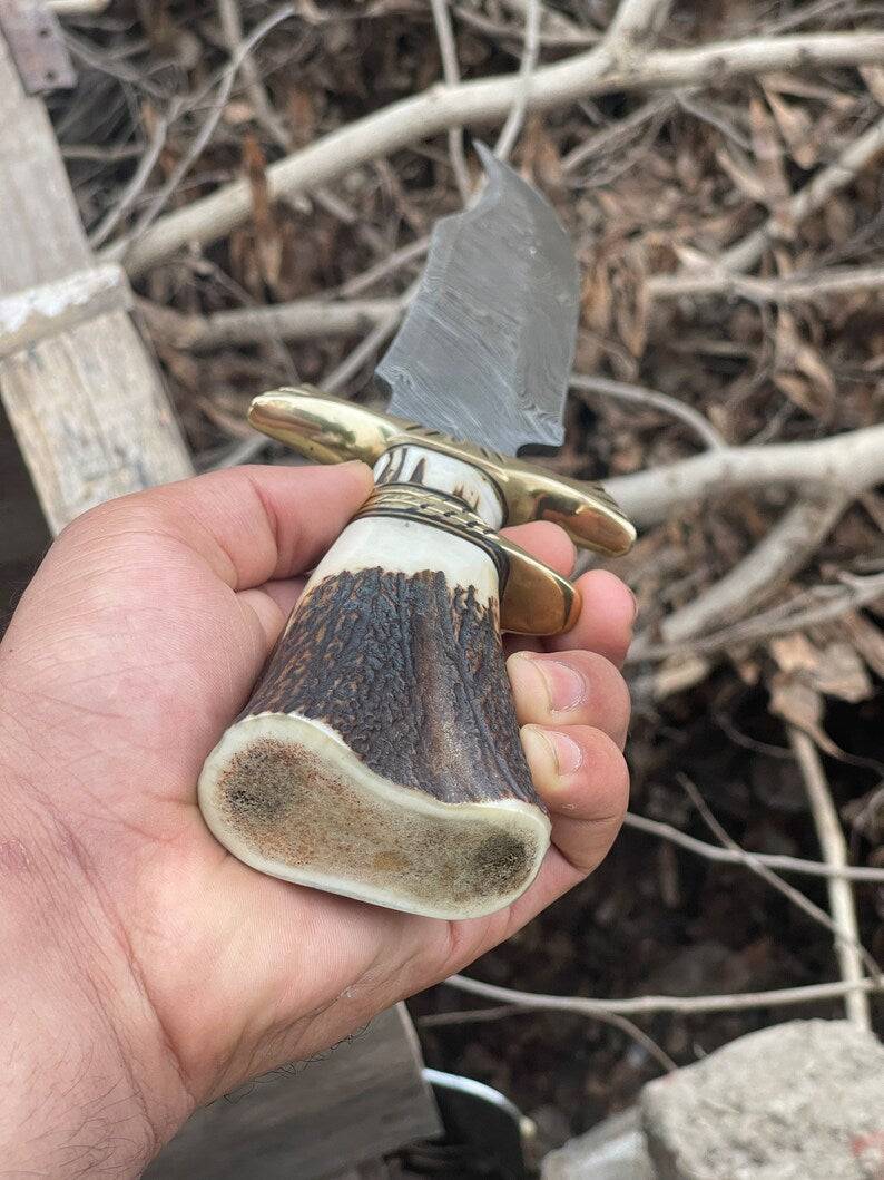 Handmade Bowie knife with a polished blade and wooden handle, crafted by Knives Gear Garage.