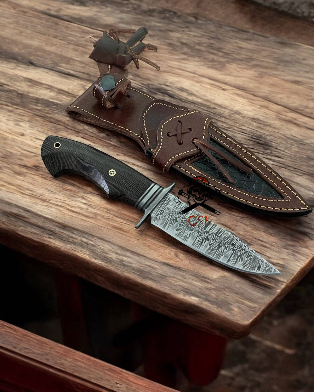 Handcrafted Bobcat hunting knife with 9.25-inch Damascus steel blade and Wengewood handle, ideal for outdoor and collector use.