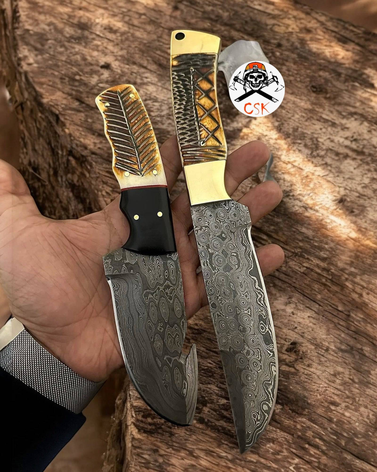 Hand-carved bone handle Damascus hunting knives from cskforged, featuring detailed craftsmanship and sharp blades.