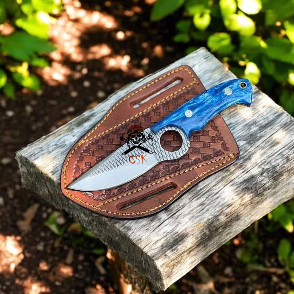 Hand-forged CSKforged EDC rasp steel knife with blue resin handle, tactical finger hole, and leather sheath.