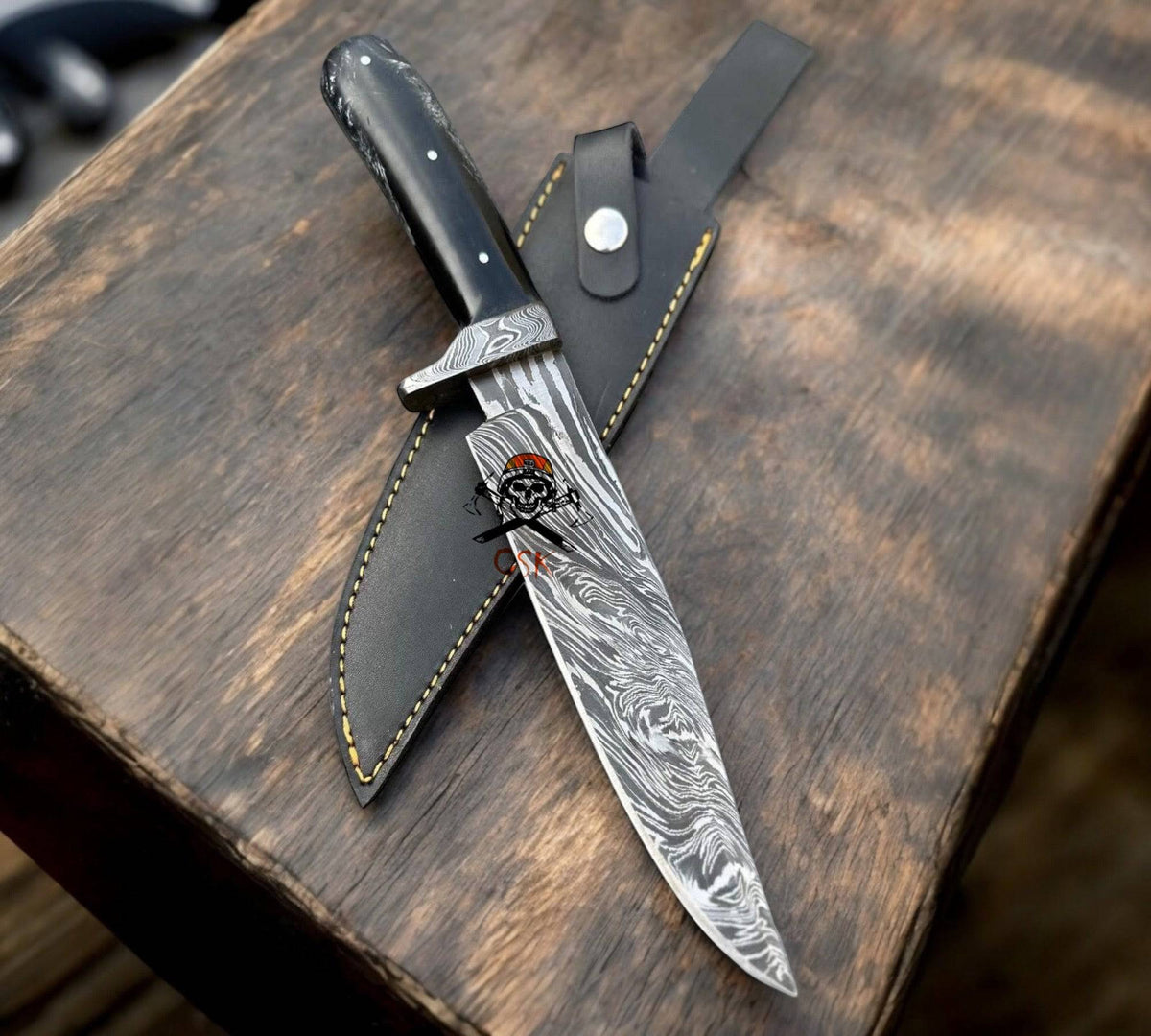 Hand-forged Damascus steel hunting knife by cskforged with full tang fixed blade and premium leather sheath.