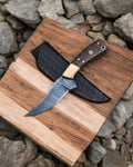 Damascus steel hunting knife with rosewood handle, handcrafted by cskforged, designed for outdoor use and outdoor enthusiasts.