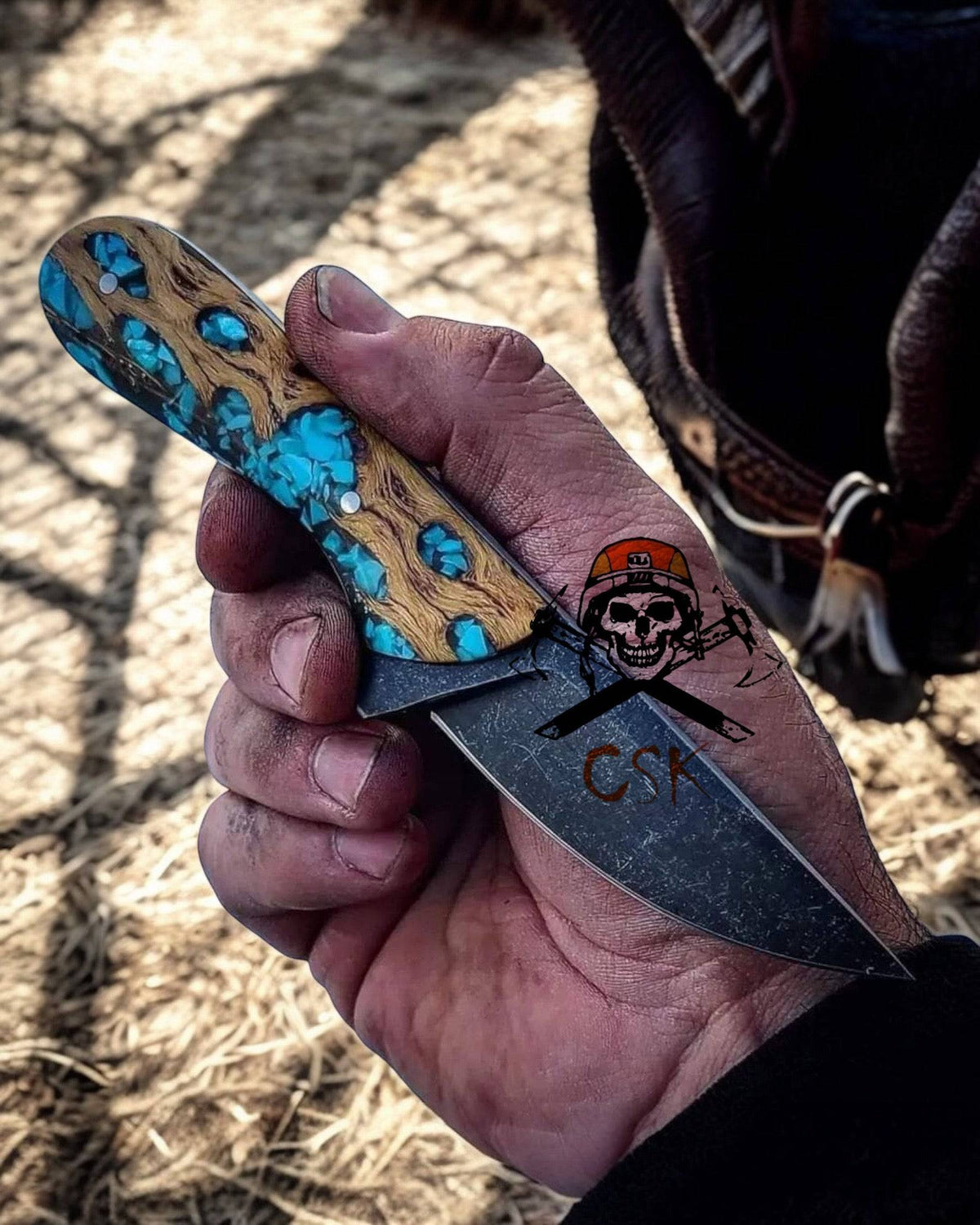 Handmade epoxy blade EDC knife by cskforged with leather sheath, featuring a rugged cowboy-inspired design.