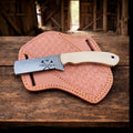 Cowboy knife with rasp steel blade, bone handle, and pancake sheath by cskforged, showing the detailed blade and handle design.