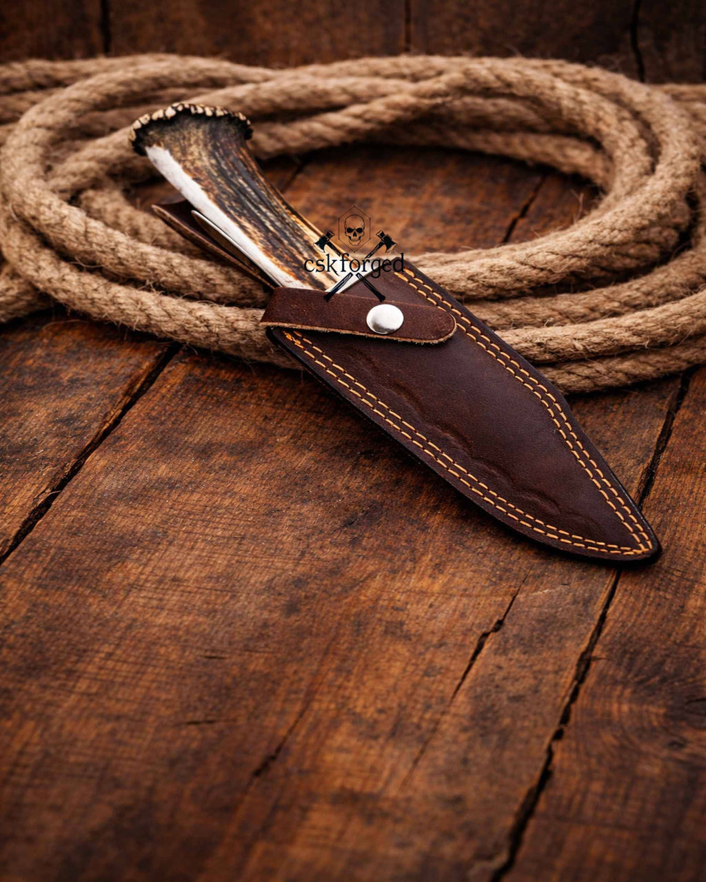 Frontier Demon Hunting Knife by cskforged with custom forged ruby blade and stag handle, ideal for survival and outdoor use.