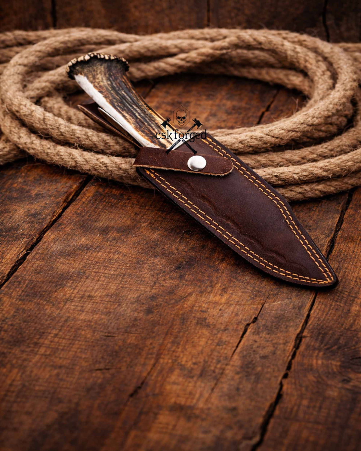 Frontier Demon Hunting Knife by cskforged with custom forged ruby blade and stag handle, ideal for survival and outdoor use.