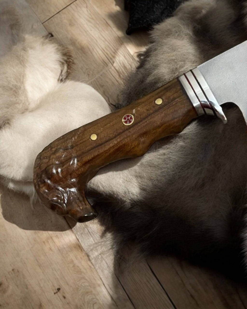 Handmade eagle head hunting knife by cskforged with a detailed eagle-shaped handle and a sharp blade for hunting purposes.