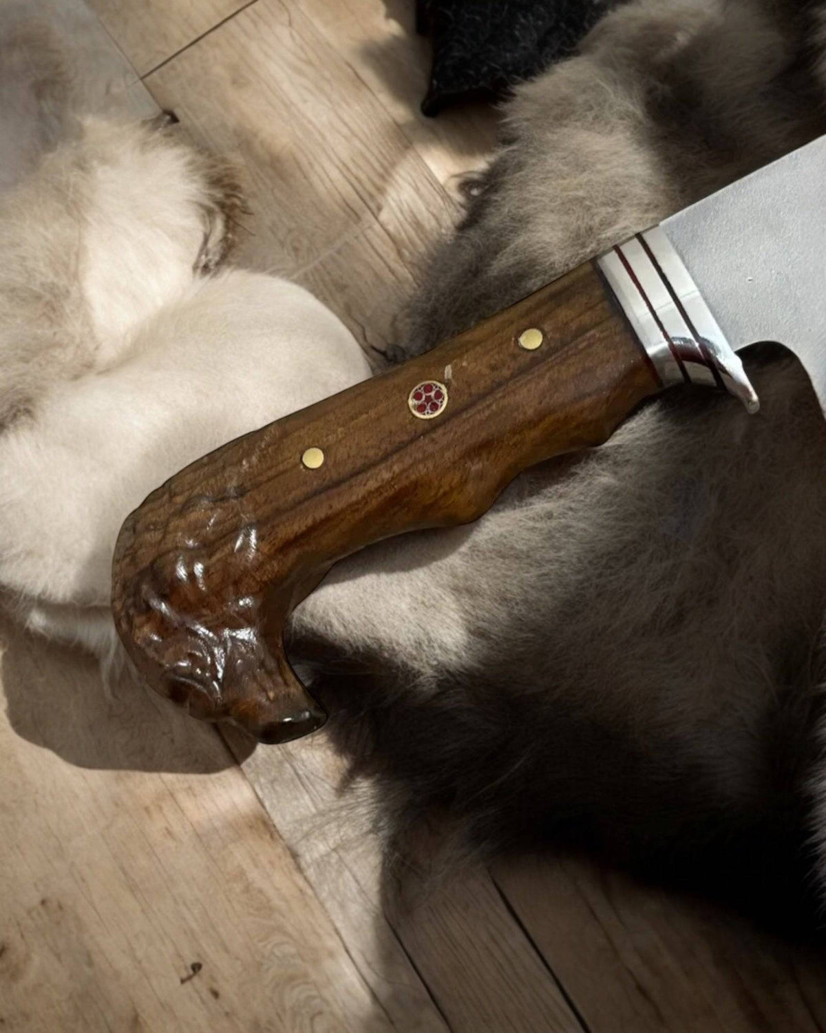 Handmade eagle head hunting knife by cskforged with a detailed eagle-shaped handle and a sharp blade for hunting purposes.