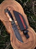 Hand-forged Damascus hunting knife with wolf pommel, custom burl wood handle, and leather sheath by cskforged.