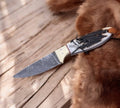 Buckaroo cowboy knife with a 3-inch Damascus blade, EDC pocket knife by cskforged, featuring a leather handle and detailed craftsmanship.
