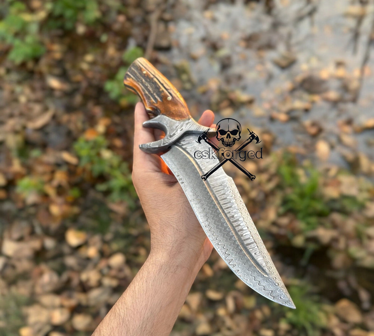 Damascus hunting knife by cskforged with stag handle in collector’s edition, featuring a sharp blade and detailed craftsmanship.