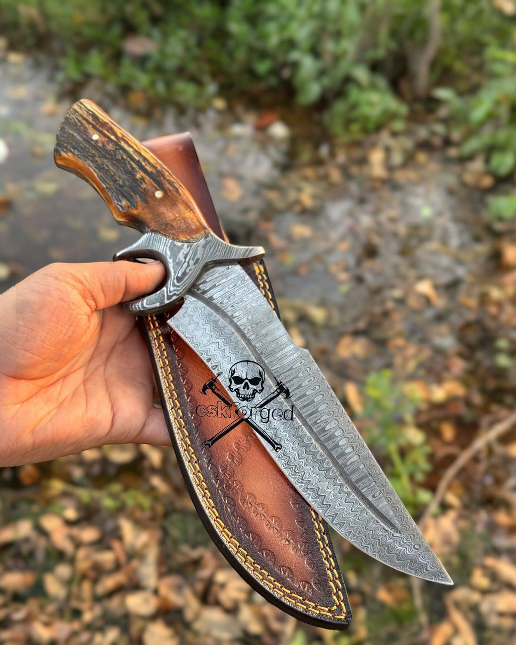 Damascus hunting knife with stag handle from cskforged Dragon Slayer Collector’s Edition, featuring intricate blade details.