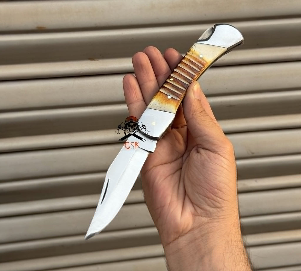 Damascus folding pocket knife by cskforged with a handcrafted lockback blade, ideal as a groomsmen gift.