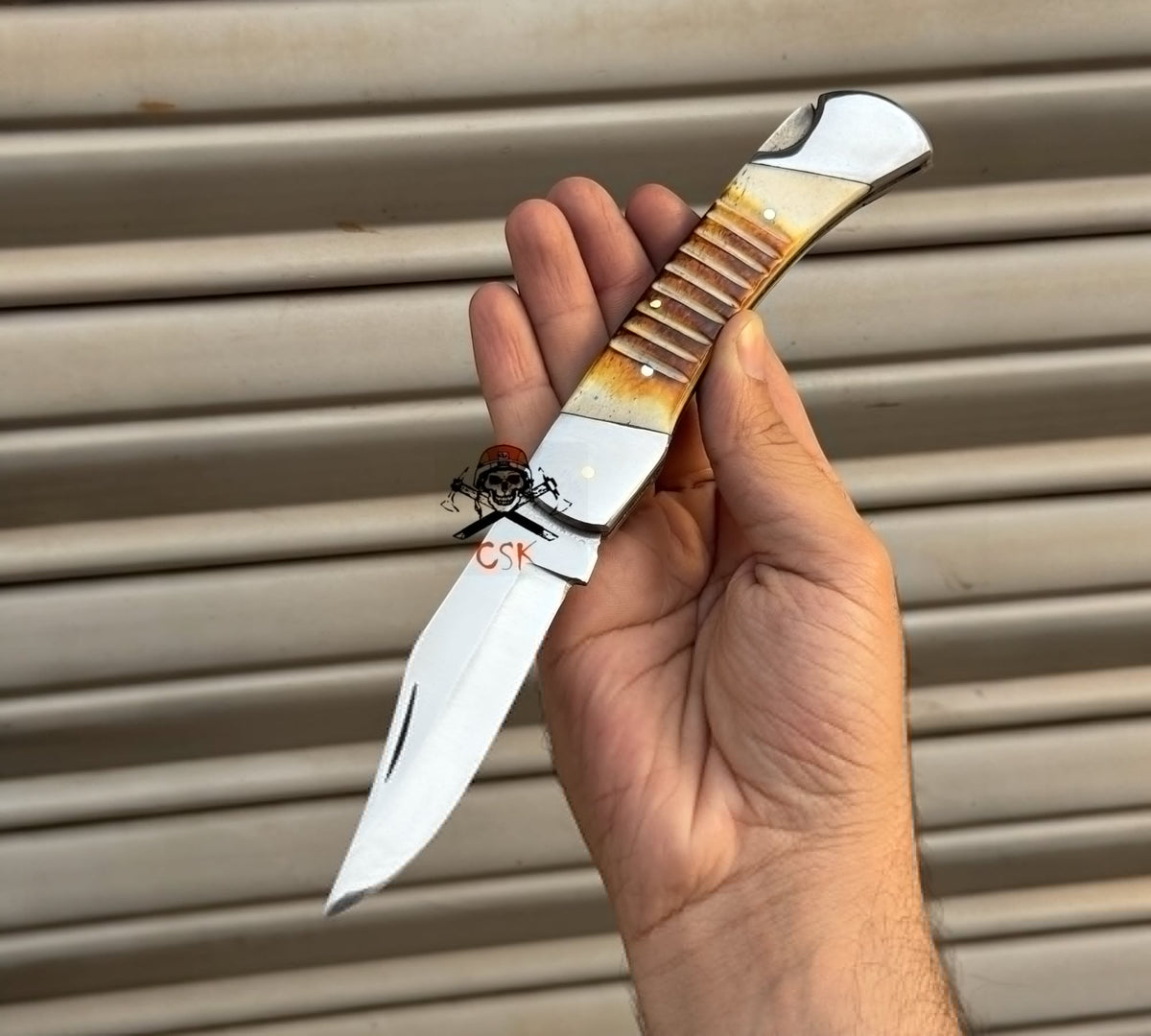 Damascus folding pocket knife by cskforged with a handcrafted lockback blade, ideal as a groomsmen gift.