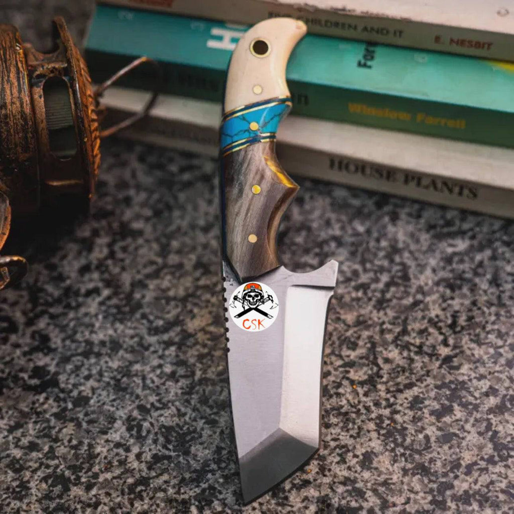 Finger grooved turquoise Tantoo Blade hunting knife by CSK Forged with a textured handle and sharp blade for outdoor use.