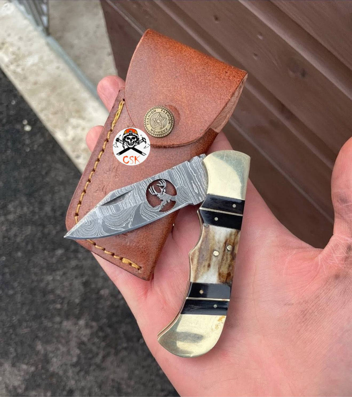 Damascus folding cowboy pocket knife with deer Damascus blade and wooden handle, by cskforged, open to show blade details.