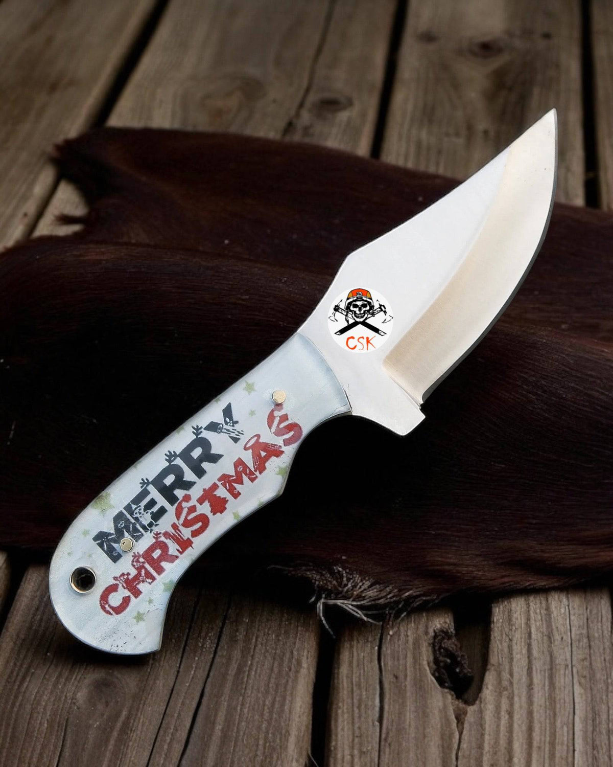 Limited edition Christmas knife by cskforged, featuring festive holiday-themed design and a sleek, polished blade.