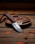 Cskforged wilderness bushcraft hunting knife with a durable burl rosewood handle and sharp steel blade.