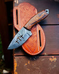 Damascus steel cross wirecut blade with rosewood handle, limited edition by cskforged, showcasing intricate craftsmanship and polished details.