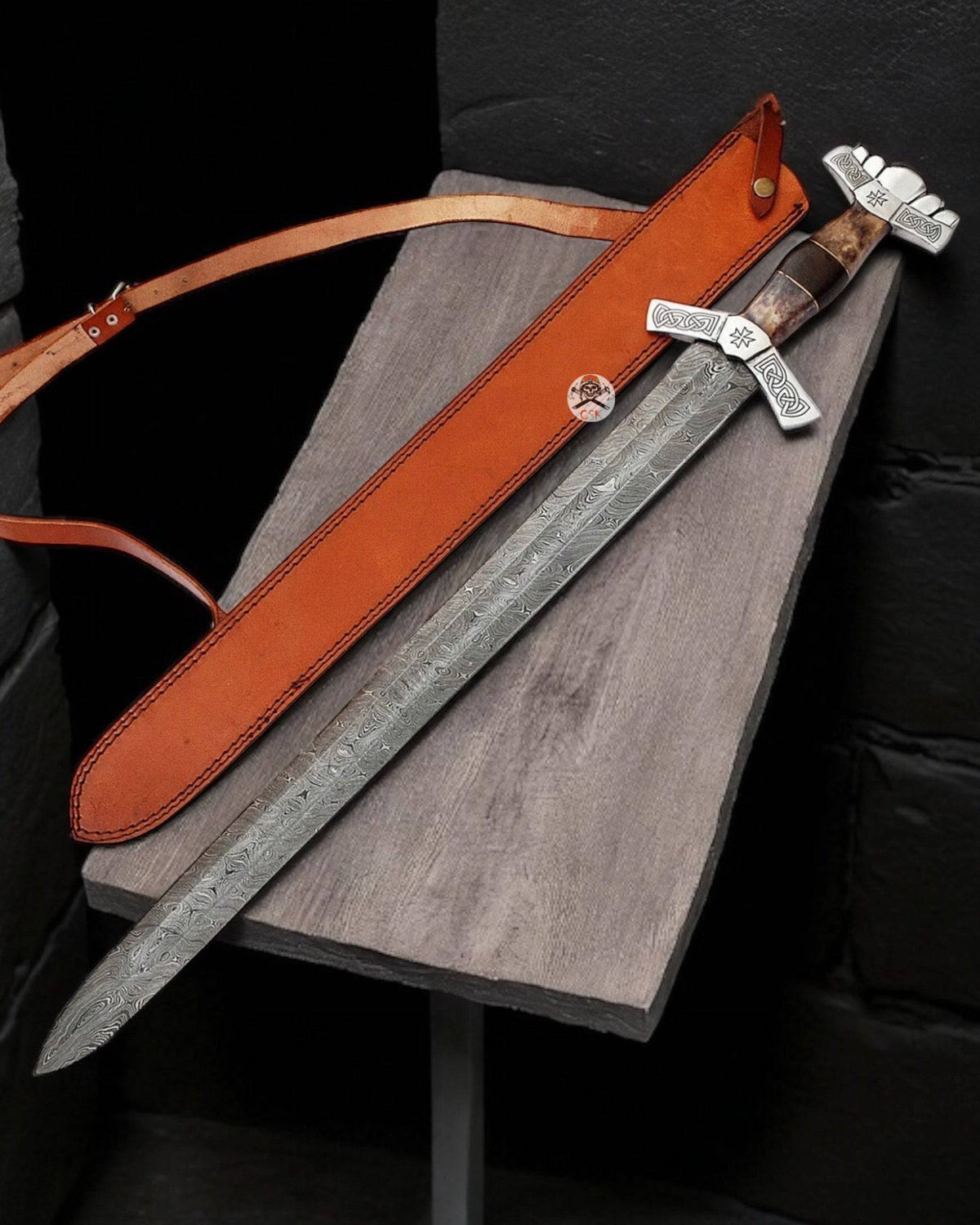 Hand-forged Valkalla Rising Damascus steel Viking knight sword with Norse-inspired design by cskforged, displayed in detail.