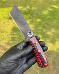 Red Viper Tanto hunting knife by cskforged featuring a textured resin handle and satin blade, displayed on a neutral background.
