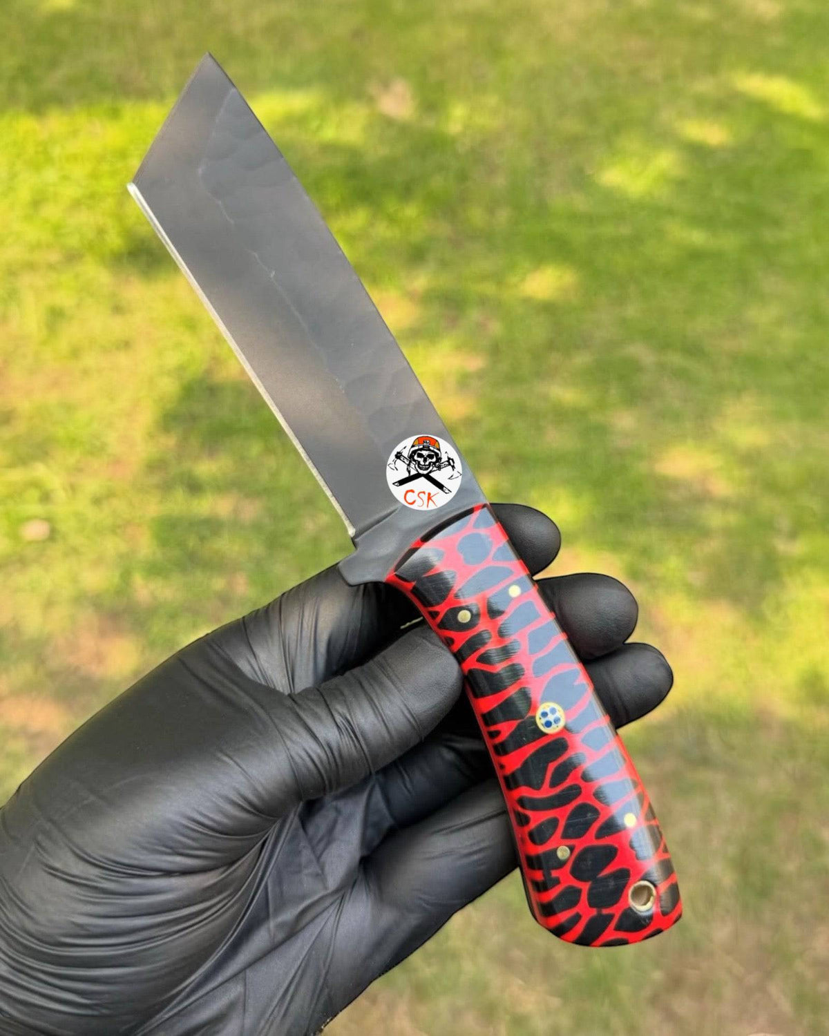 Red Viper Tanto hunting knife by cskforged featuring a textured resin handle and satin blade, displayed on a neutral background.